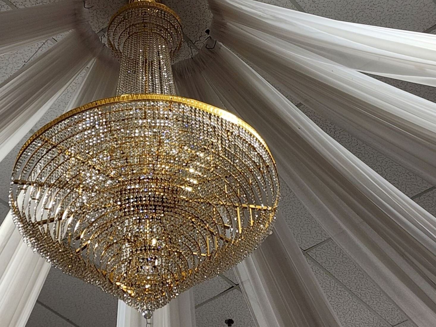 The unlit chandelier inside the Civic Center