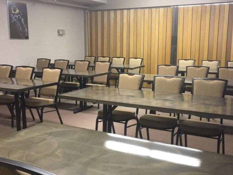 Tables and chairs set up in the conference room at the Civic Center